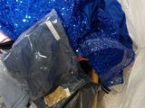 a pile of clothes and other items in a plastic bag