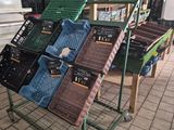 a lot of crates that are sitting on a cart