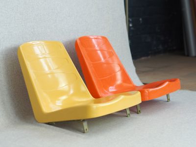 two chairs that are next to each other on the floor