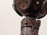 a close up of a lamp with a bird on it
