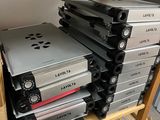 a lot of electronic equipment on a shelf in a room