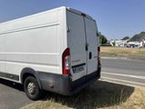 a white van that is parked on the side of the road
