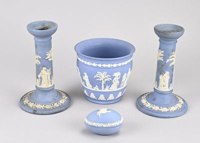 three vases and a bowl sitting on a table