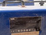an image of a blue machine with a label on it