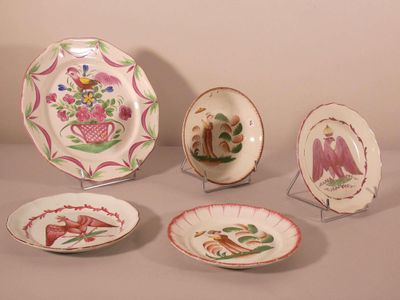 five plates with different designs on them on a table