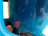 a close up of a blue blender on a table