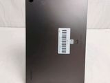 the back of a laptop with a barcode on it