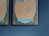 two cards that are sitting on a table