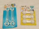 two plastic toothbrushes in the packaging on the table