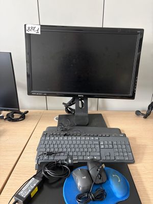 a computer desk with a monitor, keyboard, mouse, and mouse pad