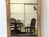 a mirror that is hanging on the wall
