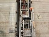 a ladder that is leaning against a building