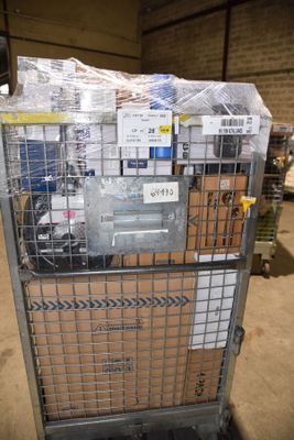 a metal cart with a bunch of boxes in it