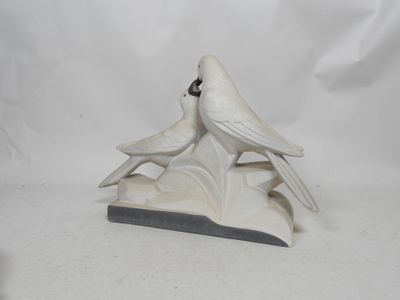 porcelain figurine of two birds perched on a leafy branch
