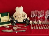 a table with silverware and a picture frame on it