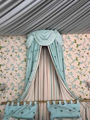 two beds in the room with a canopy over them