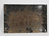 a picture of a piece of metal with rust on it
