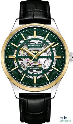 un gros plan d'une montre sur fond blanc, avec un cadran vert