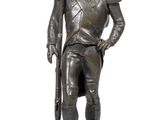 bronze statue of a soldier with a rifle on a marble base