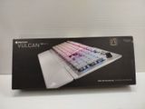 packaging of a white keyboard with a pink and blue key board