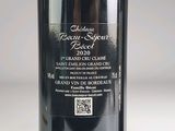 a bottle of wine that is sitting on a table