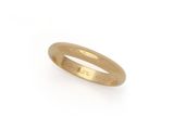 a close up of a gold ring on a white background