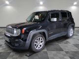 une photo d'une jeep noire garée dans un garage
