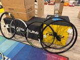 two bikes that are sitting next to each other on a table