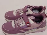 purple and white sneakers with a red heart on the side