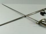 an image of a pair of two swords on a white surface