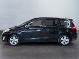 a picture of a small black car parked in a garage