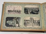 an open book with pictures of a city on it