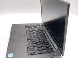 a laptop that is sitting on a white table