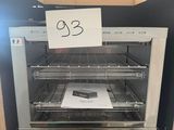 a toaster oven that has a sign on it