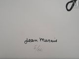 an image of a close up of a person ' s hand writing on a piece of paper