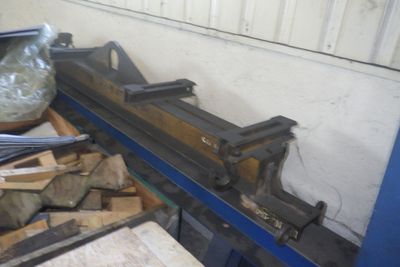 a machine that is sitting on top of a pile of wood
