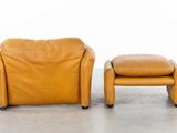 an image of a pair of leather chairs and a foot stool