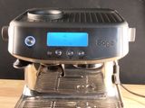 a coffee machine that is sitting on a wooden table