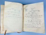 an open book with a drawing of a tree on top of it