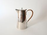 an image of a silver coffee pot on a white surface
