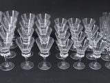 a close up of a bunch of wine glasses on a table