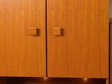 an image of a wooden cabinet in a living room