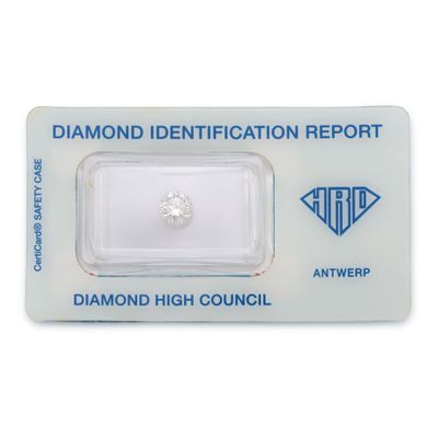 a white diamond with a diamond identification report on top of it