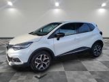 a white renault c - hr suv parked on a checkered floor