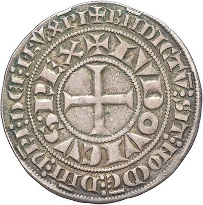 a close up of a coin with a cross on it