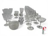 a lot of glasses and a bowl on the table