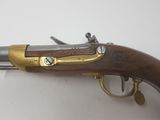 an old gun that is sitting on top of a table