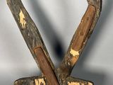 an image of a wooden sculpture of a man holding a baseball bat