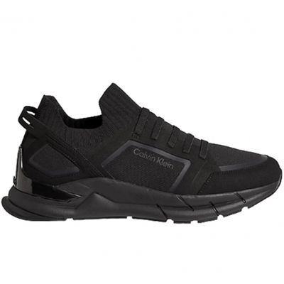 men ' s black sneakers with a rubber sole and a rubber sole