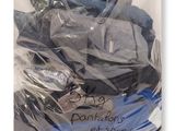 a bag full of clothes that is wrapped in plastic